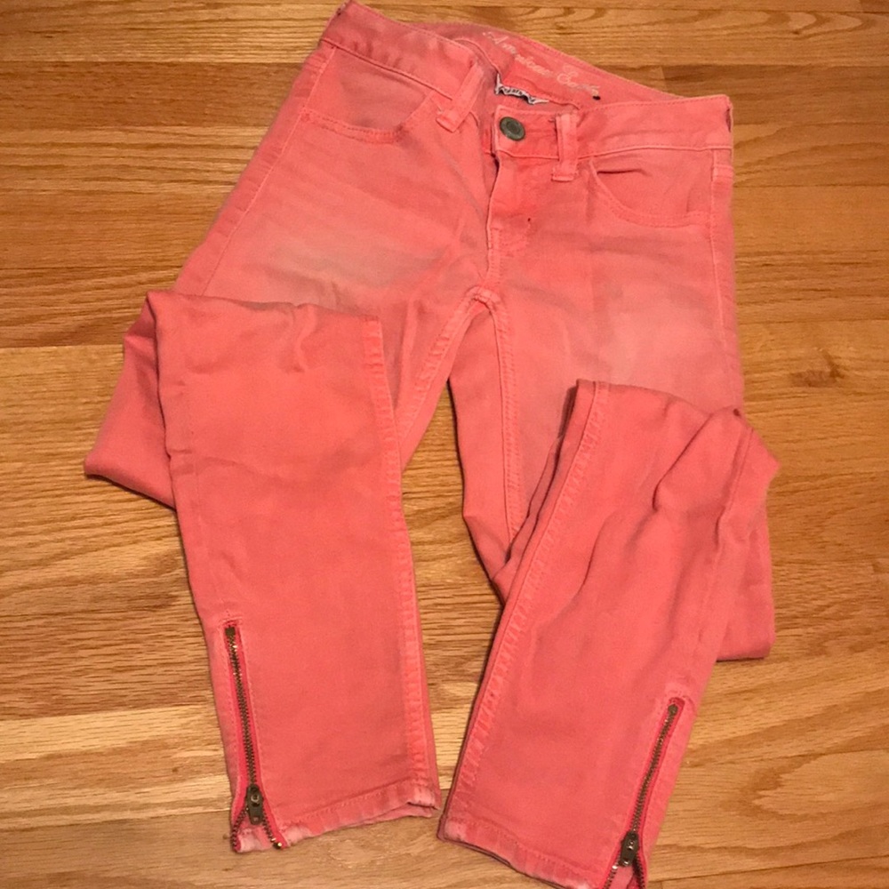 Pink distressed wash skinny jeans